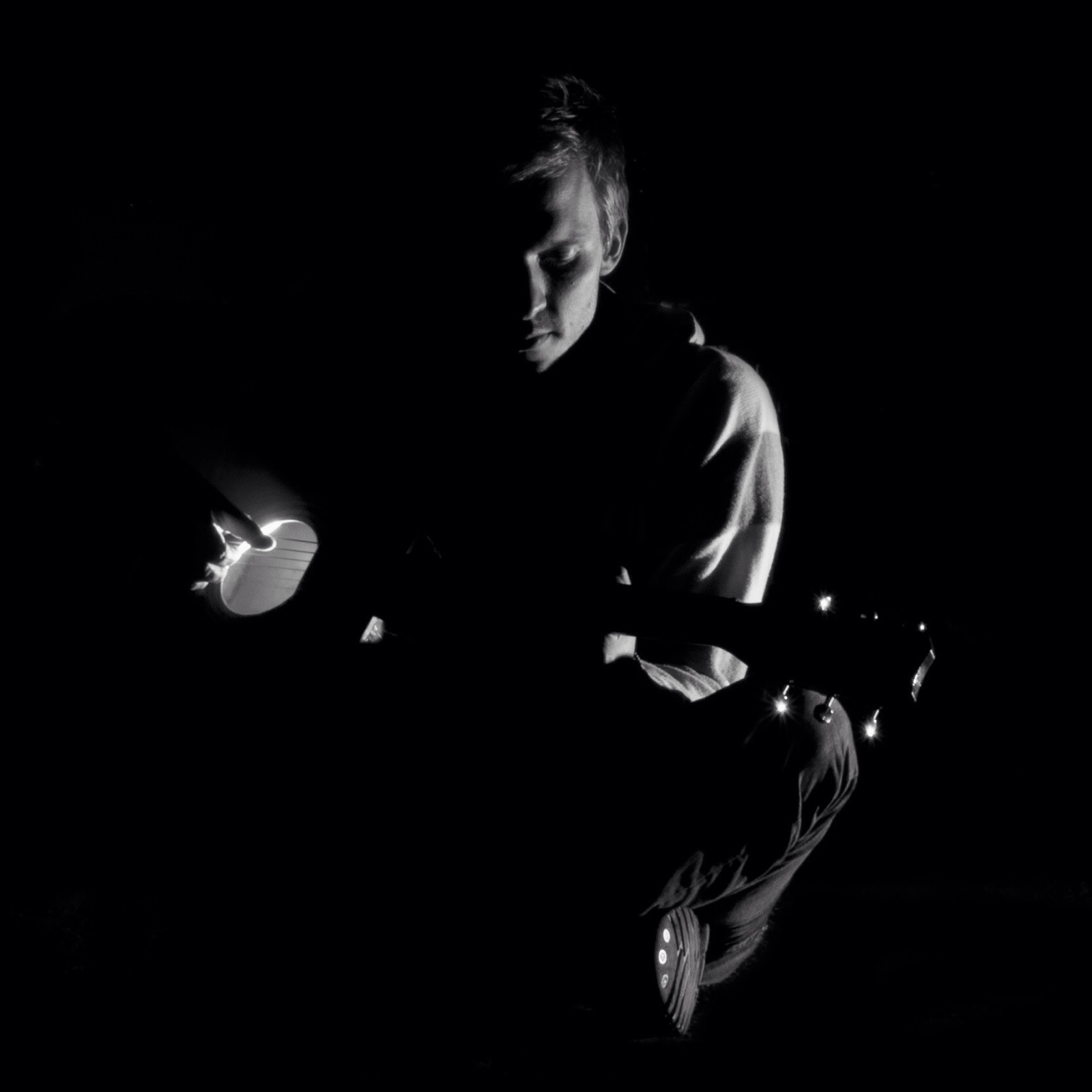 Rudolf Smetana playing guitar in the dark